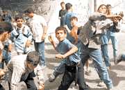 Intifadah: Palestinian kids stoning Israeli soldiers